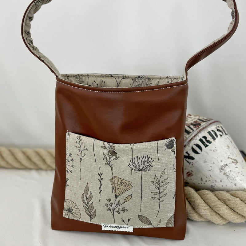 Einkaufsshopper mit einem breiten Schulterträger