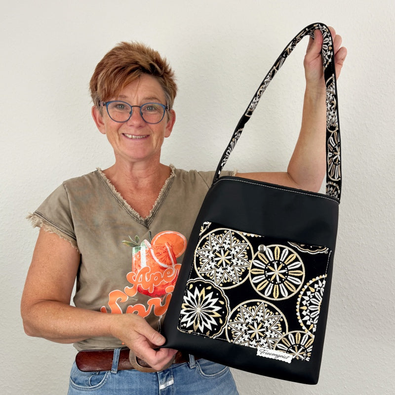 Einkaufsshopper mit einem breiten Schulterträger
